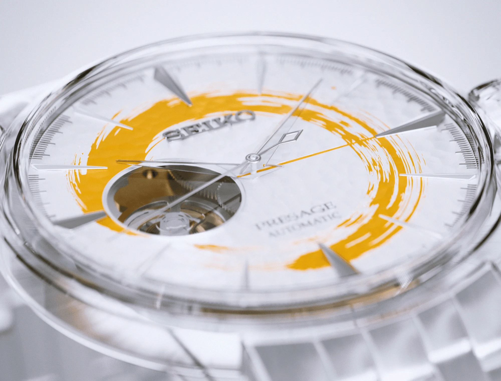 Close view of the completed transparent dial with an orange circular brushstroke